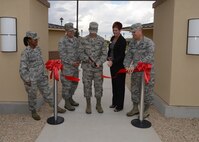 Brig. Gen. Scott Pleus, 56th Fighter Wing commander, Col. James Pease, Air Education Training Command director, manpower, personnel, and services, Col James Kossler, 56th Mission Support Group commander, Maj. Tonya Mack, 56th Force Support Squadron commander, and Jane Yates, 56th FSS lodging manager, officially cut the ribbon to the new lodging facility October 29, 2015, at Luke Air Force Base, Arizona.  The new lodging facility will be completed and open to Luke patrons mid- November of 2015. (U.S. Air Force photo by Staff Sgt. Marcy Copeland)     