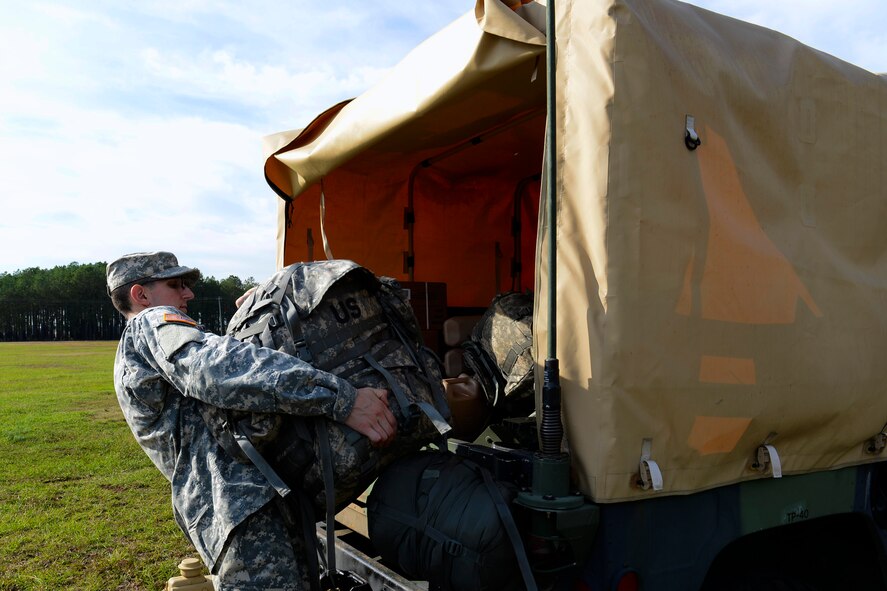 U.S. Army Private 1st Class Andrew Heitkamp, U.S. Army Central Bravo Company 67th Expeditionary Signal Battalion satellite systems specialist, transports gear to a vehicle during a training exercise at Shaw Air Force Base, S.C., Oct. 29, 2015. Extensive satellite system training is done four to five times every year to keep ARCENT soldiers ready to deploy at moment’s notice. (U.S. Air Force photo by Airman 1st Class Christopher Maldonado/Released)