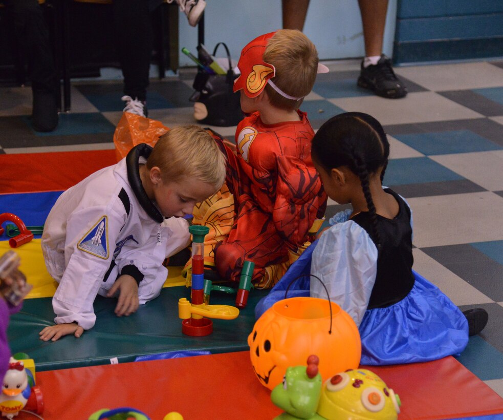 Kids enjoy the Youth Center's annual Halloween event Bootastic Oct. 23. The event provided a free night of games, prizes, safe trick-or-treating and other fun activities. (Photo by Jamie Burnett)