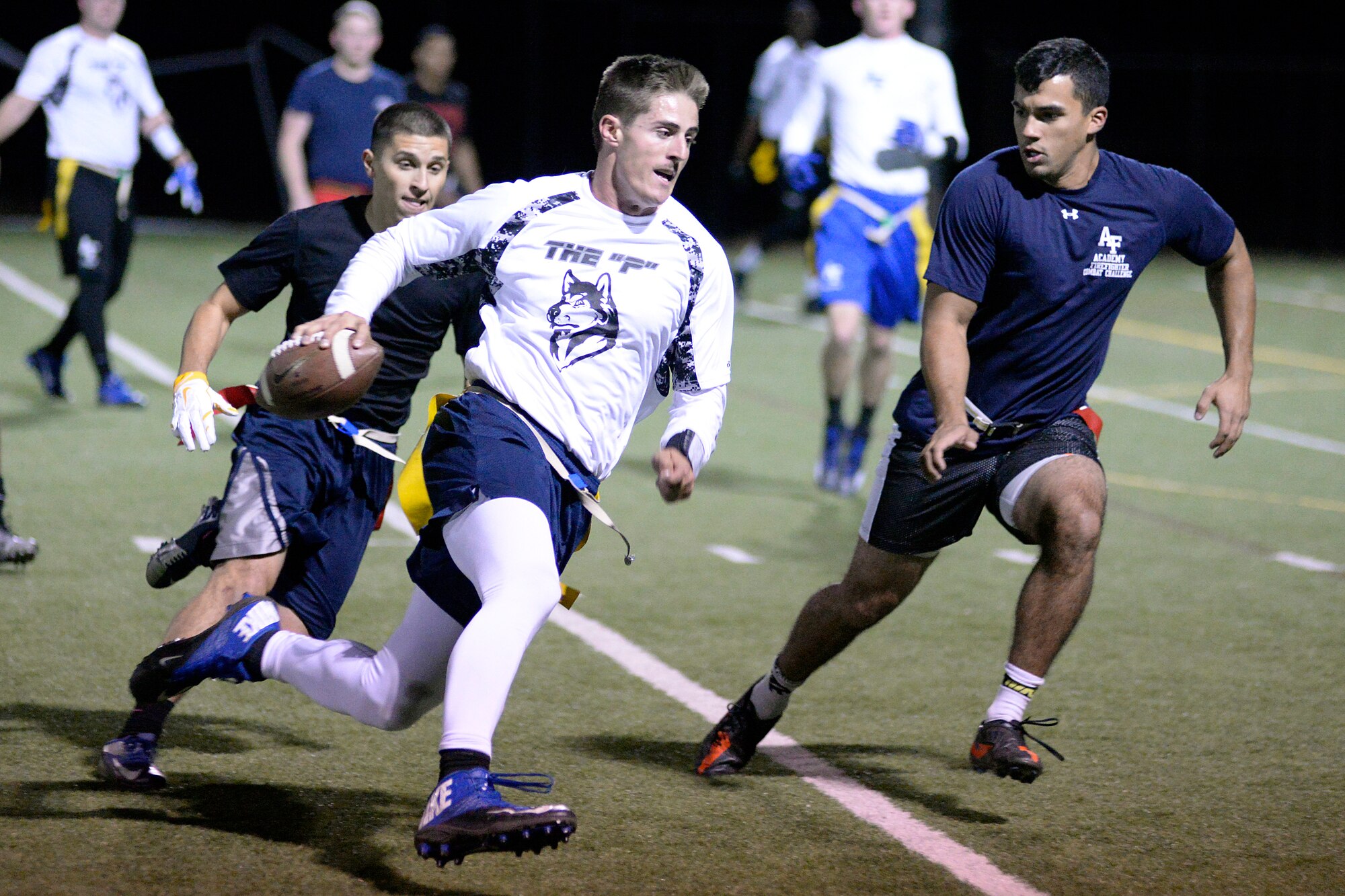 U.S. Air Force Academy intramural football quarterback Austin Gouldsmith runs with the ball during the championship game here Oct. 17, 2015 against the 10th Civil Engineer Squadron Fire Department. Prep School beat the Fire Dept.26-7. (U.S. Air Force photo/Mike Kaplan)

