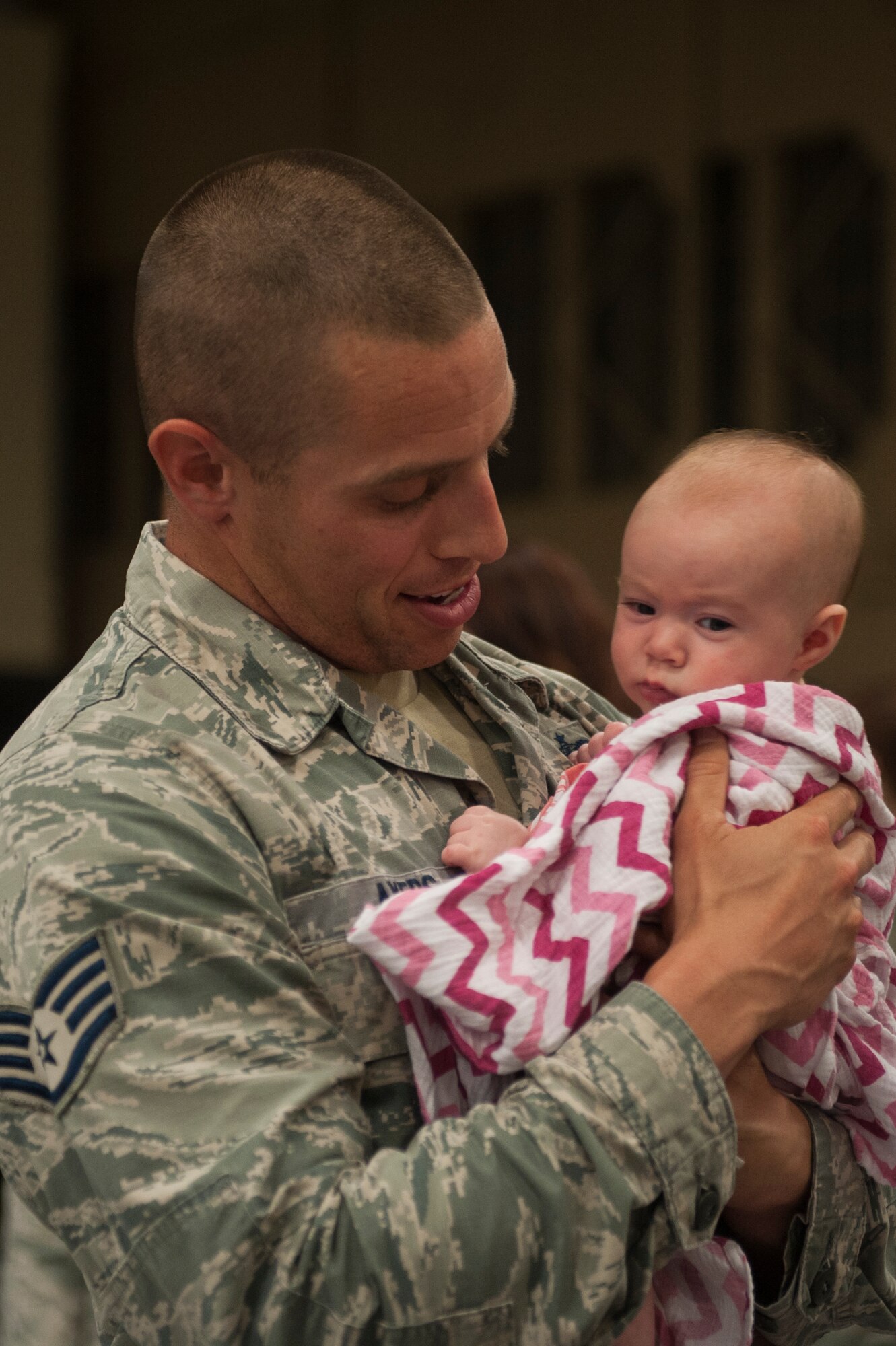 U.S. Air Force Staff Sgt. Dallas Ayers, 823d Base Defense Group unit deployment manager, meets his daughter, Bristol, for the first time during a re-deployment ceremony, Oct. 27, 2015, at Moody Air Force Base, Ga. Bristol was born three months after her father left for a six-month deployment in April. (U.S. Air Force photo by Airman 1st Class Kathleen D. Bryant/Released)
