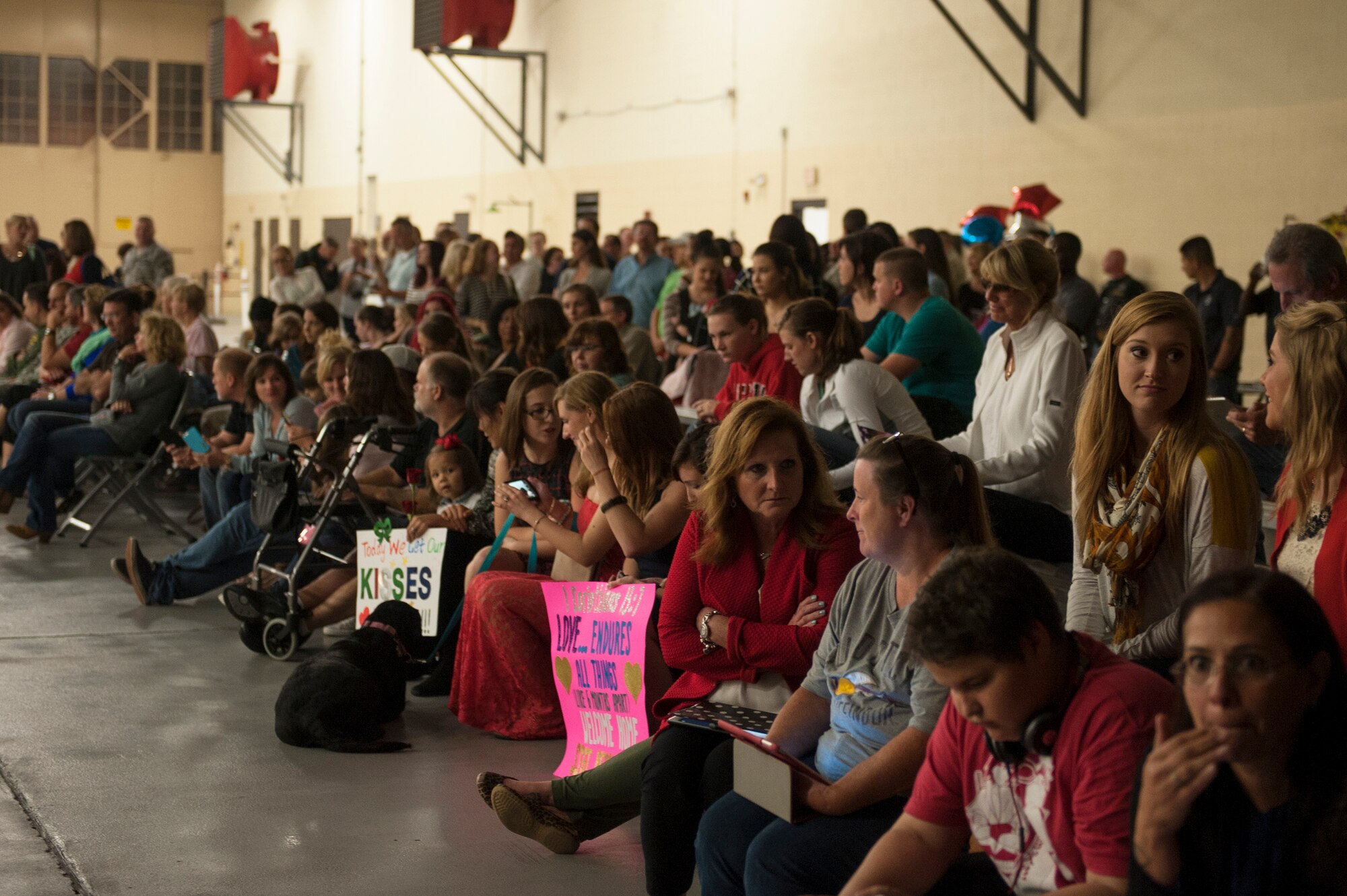 Families await the return of Airmen from the 823d Base Defense Squadron during a re-deployment ceremony, Oct. 27, 2015, at Moody Air Force Base, Ga. Approximately 120 Airmen from the 823d BDS were reunited with their loved ones after a six-month deployment. (U.S. Air Force photo by Airman 1st Class Kathleen D. Bryant/Released)
