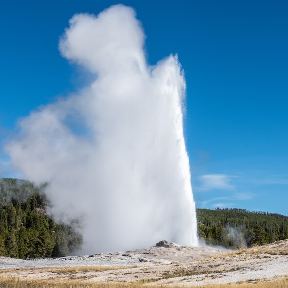 Old Faithful shoots water into the air at Yellowstone National Park, Wyoming Oct. 10, 2015. The geyser is the park’s most visited attraction and can launch 3,700 to 8,400 gallons of boiling water up to 185 feet in the air. A single eruption can last anywhere from one to five minutes. (U.S. Air Force photo by Airman 1st Class Connor J. Marth)