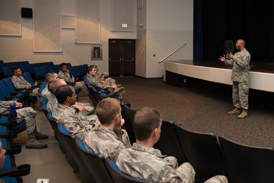 The 375th Air Mobility Wing Command Chief Master Sgt. Wesley Mathias spoke with Airmen during a closing ceremony Oct. 21, 2015, at Scott Air Force Base, Ill. The ceremony was a part of the First Four Leadership Conference or FALCON held annually for Airmen by Airmen. The conference involved several workshops and classes revolving around the topics chosen by airmen to help with the growth and development of their military or civilian career. Chief Mathias also awarded the winners of the workshops their trophies and announced the new First Four Council Members. (U.S. Air Force photo/ Airman Gwendalyn Smith)