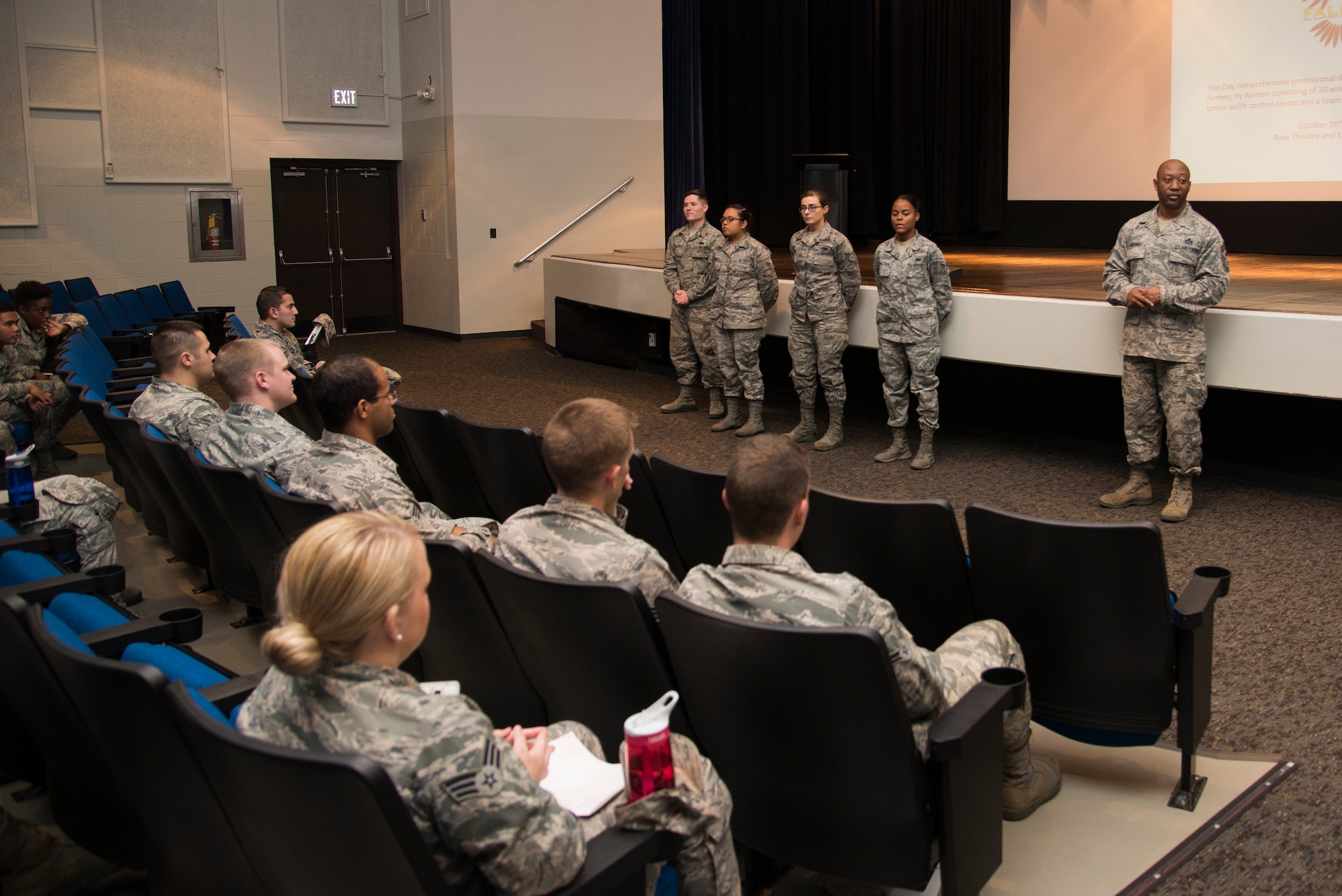 The 375th Air Mobility Wing Command Chief Master Sgt. Wesley Mathias spoke with Airmen during a closing ceremony Oct. 21, 2015, at Scott Air Force Base, Ill. The ceremony was a part of the First Four Leadership Conference or FALCON held annually for airmen by airmen. The conference involved several workshops and classes revolving around the topics chosen by airmen to help with the growth and development of their military or civilian career. Chief Mathias also awarded the winners of the workshops their trophies and announced the new First Four Council Members. (U.S. Air Force photo/ Airman Gwendalyn Smith)