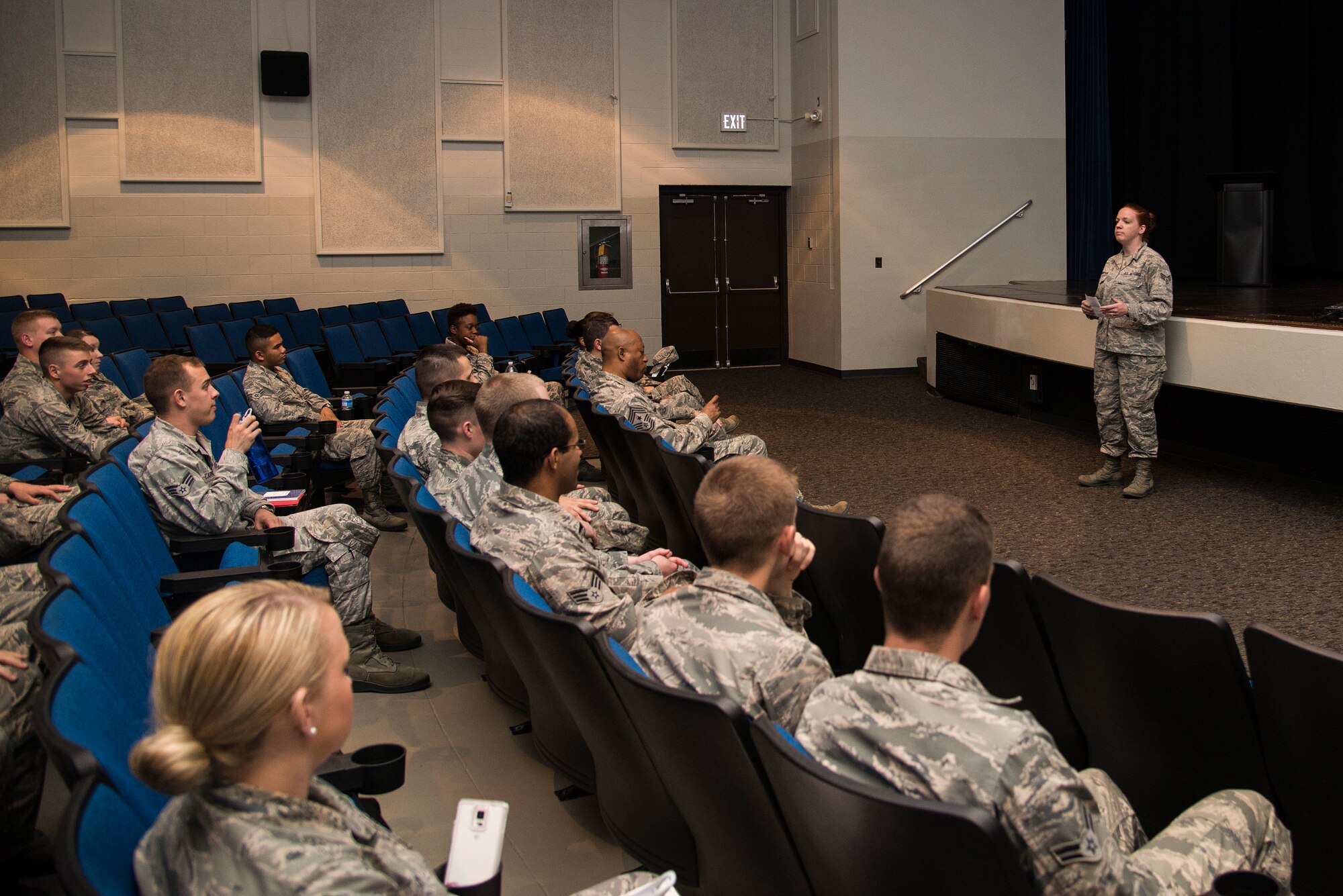 Senior Airman Courtney Thompson speaks during the closing ceremony of the First Four Leadership Conference. The ceremony was a part of the First Four Leadership Conference or FALCON held annually for airmen by airmen. The conference involved several workshops and classes revolving around the topics chosen by airmen to help with the growth and development of their military or civilian career. (U.S. Air Force photo/ Airman Gwendalyn Smith)
