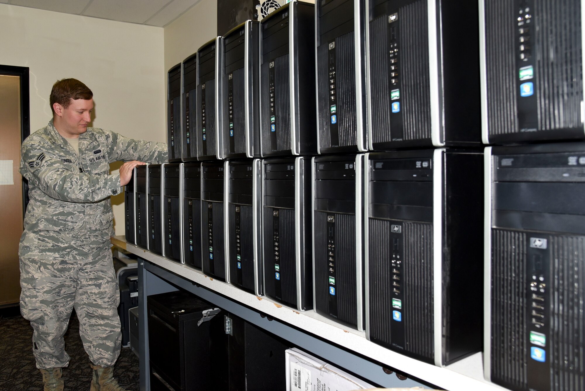 Senior Airman Bradly Stinger, 92nd Communications Squadron client systems technician, checks the serial numbers on the computers for the base's technology refresh Oct. 29, 2015, at Fairchild Air Force Base, Wash. Technology refresh is a process Information Technology Asset Management does to replace old computers with new ones, which happens all year. Stinger is one of the many Airmen who are responsible for troubleshooting and repairing any computer issues base personnel may have. (U.S. Air Force photo/Senior Airman Janelle Patiño)
