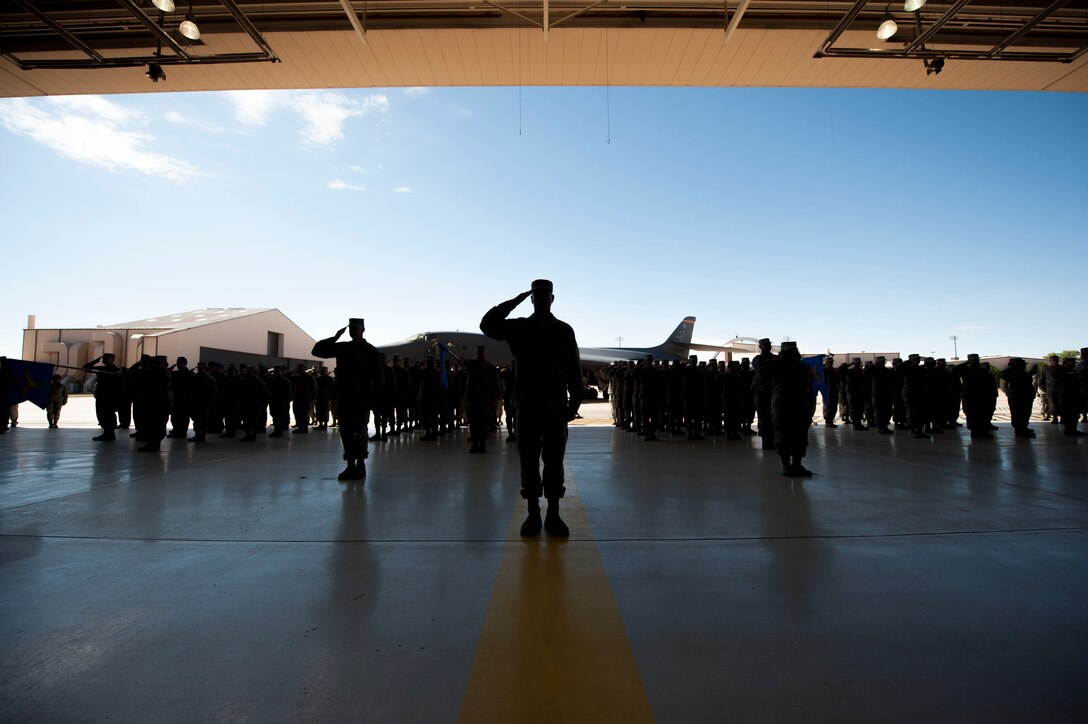 Airmen salute in formation during the 7th Bomb Wing change of command ceremony Oct. 29, 2015, at Dyess Air Force Base, Texas. Col. David Benson assumed responsibilities for leading the 7th BW, which provides B-1B Lancers and combat-ready Airmen capable of delivering overwhelming long-range strike anywhere in the world within hours. (U.S. Air Force photo by Airman Quay Drawdy/ Released)