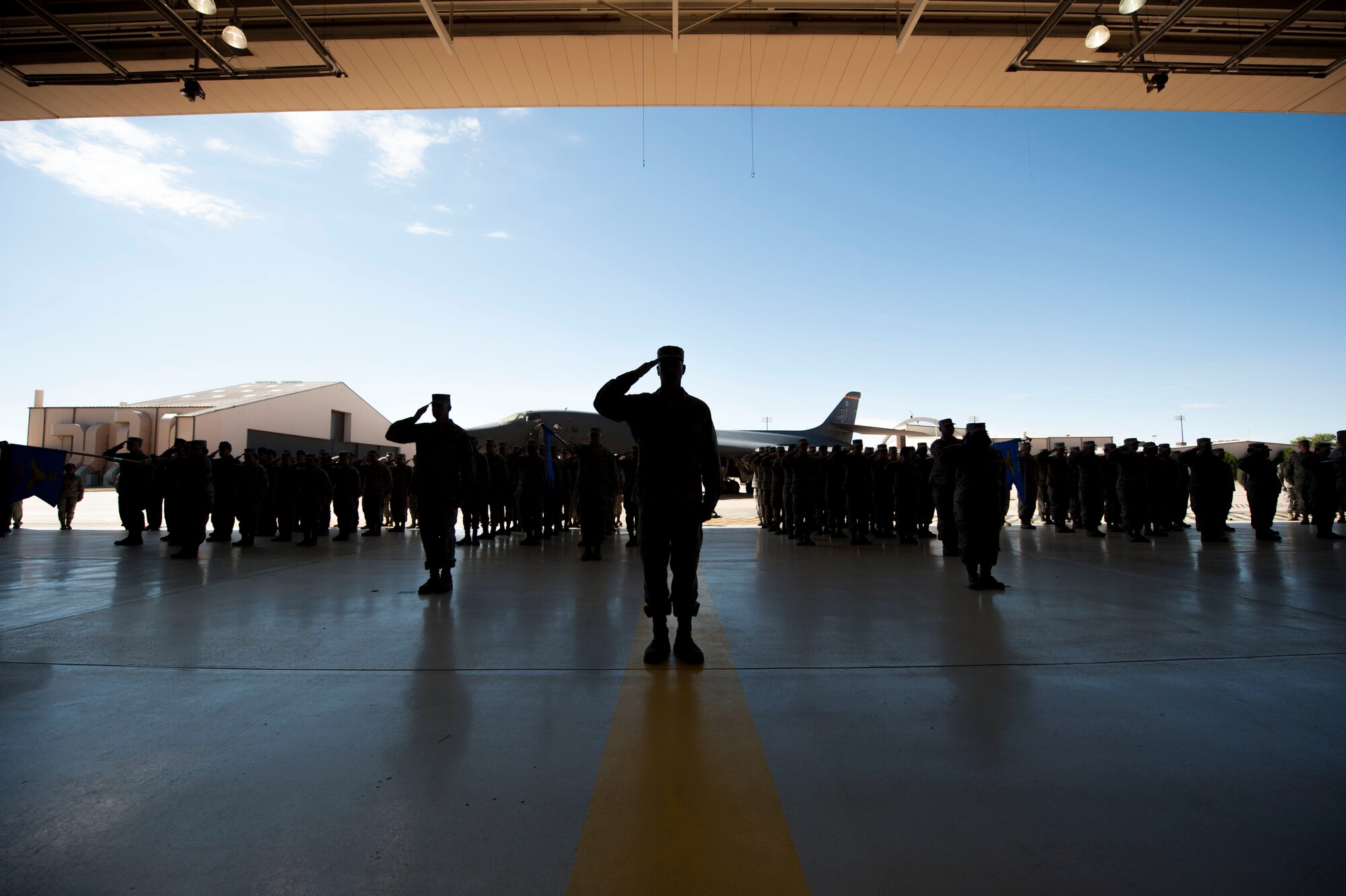 Airmen salute in formation during the 7th Bomb Wing change of command ceremony Oct. 29, 2015, at Dyess Air Force Base, Texas. Col. David Benson assumed responsibilities for leading the 7th BW, which provides B-1B Lancers and combat-ready Airmen capable of delivering overwhelming long-range strike anywhere in the world within hours. (U.S. Air Force photo by Airman Quay Drawdy/ Released)