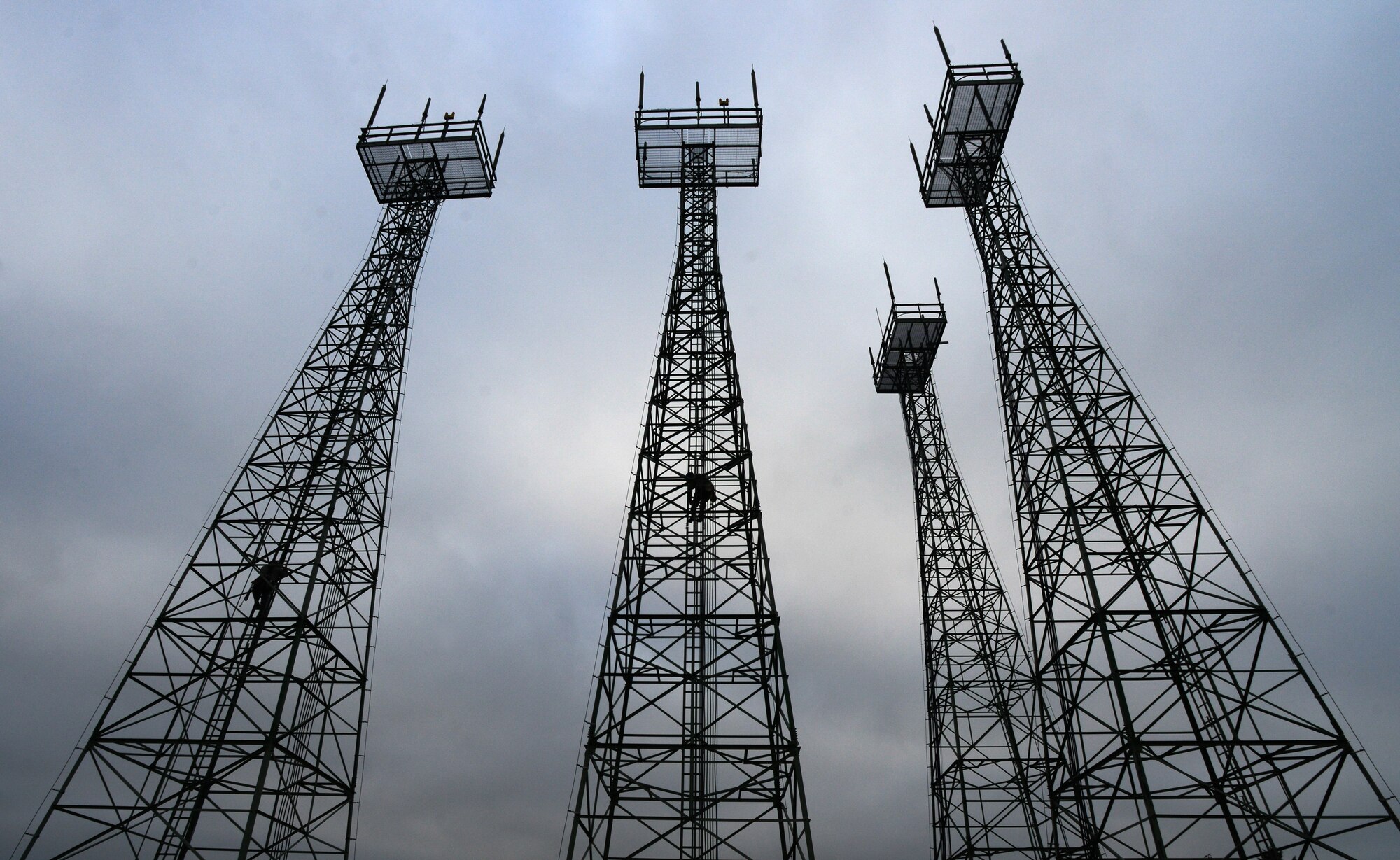 Cable and antenna systems technicians from the 1st Communications Maintenance Squadron climb telephone towers Oct. 9, 2015, at Ramstein Air Base, Germany.  The 1st CMXS Airmen participated in the Specialized Technical Aided Rescue Training to familiarize themselves with safety procedures involved in rescuing a fall victim. (U.S. Air Force photo/Senior Airman Nicole Sikorski)

