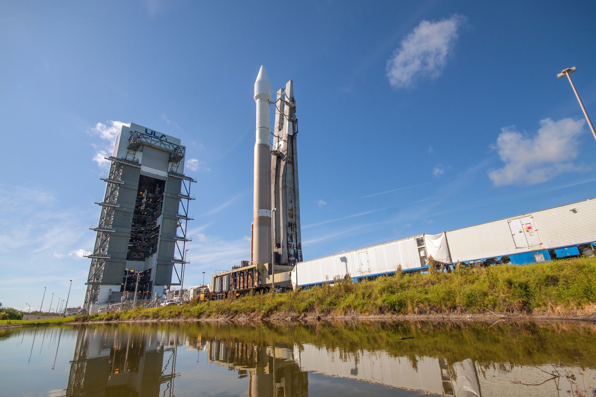 A low angle view of the Atlas V 401 launch vehicle with GPS IIF-11 satellite aboard is rolled from the Vertical Integration Facility to Space Launch Complex-41 in anticipation of a Saturday afternoon launch from Cape Canaveral Air Force Station, Fla. The launch window opens Oct. 31 at 12:13 EDT (9:13 a.m. PDT). This is the second to last GPS IIF launch in a series of 12 spacecraft. (Photo courtesy United Launch Alliance).