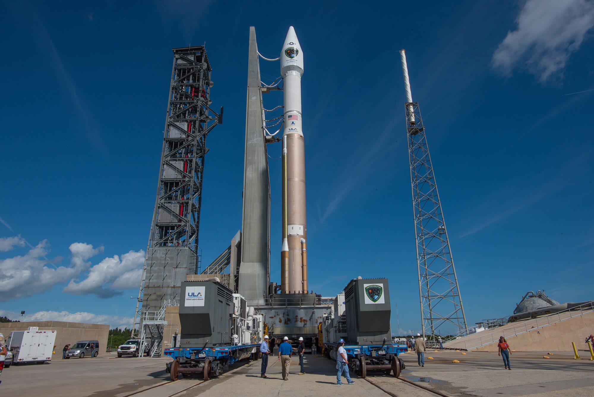 A pad view of the Atlas V 401 launch vehicle with GPS IIF-11 satellite aboard at Space Launch Complex-41 in anticipation of a Saturday afternoon launch from Cape Canaveral Air Force Station, Fla. The launch window opens Oct. 31 at 12:13 EDT (9:13 a.m. PDT). This is the second to last GPS IIF launch in a series of 12 spacecraft. The gray structure just to the left of the mobile launch platform is a new Crew Access Tower, currently nearing completion for future use by astronauts with the Boeing CST-100 manned spacecraft, slated for first flight in December 2017. (Photo courtesy United Launch Alliance).