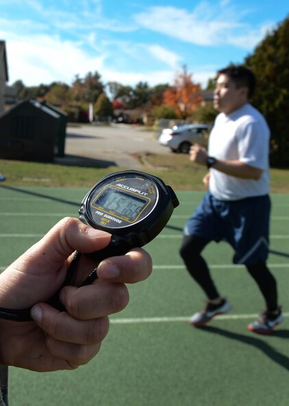 Capt. Thomas Lee, Geospatial Intelligence program manager, is timed on the base track during the run phase of the physical fitness test last month. The 66th Force Support Squadron has issued guidance on how fitness assessments will be conducted during winter weather conditions at Hanscom. The guidance is in accordance with AFI 36-2905. The physical fitness assessment winter schedule begins Dec. 1. Assessments will take place Tuesday through Thursday at 8 a.m., 9:30 a.m., and 11 a.m. with eight testing slots available per session. (U.S. Air Force photo by Jerry Saslav)