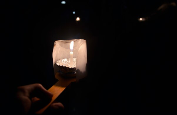 A person uses a candle for light during a low lit area of the Enoshima Iwaya Cave in Fujisawa City, Japan, Oct. 25, 2015. The cave was eroded by waves and is composed of two caverns. (U.S. Air Force photo by Senior Airman David Owsianka/Released)