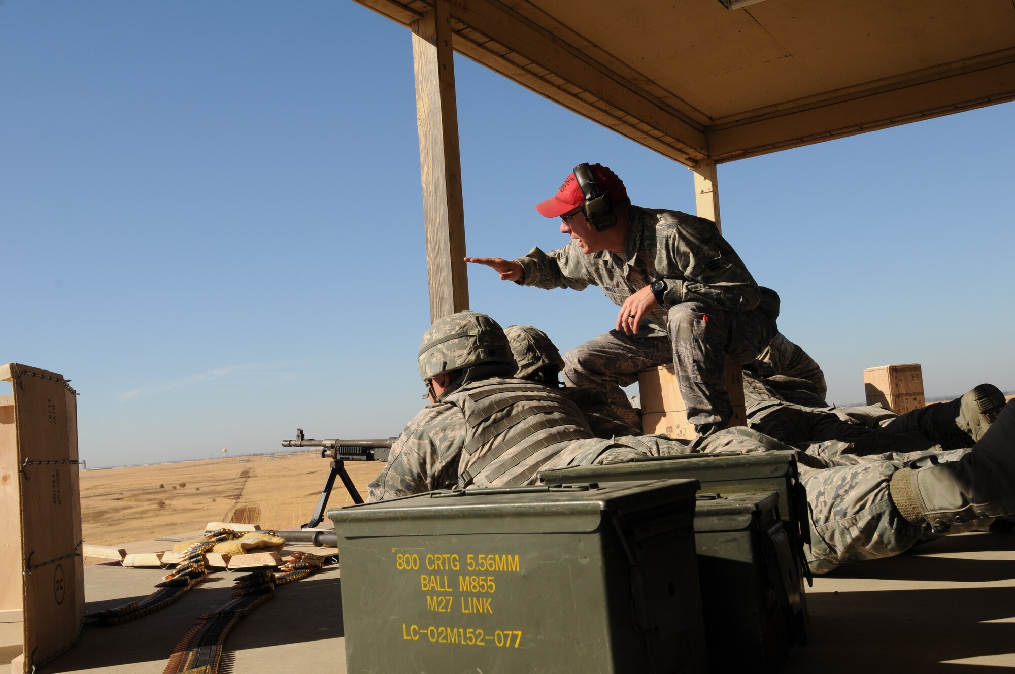 U.S. Airmen with the 129th Security Forces Squadron, California Air National Guard perform heavy arms training, Beale Air Force Base, Calif., Oct. 9, 2015. The training is in preparation for a future deployment.  (U.S. Air National Guard photo by Kim E. Ramirez/Released)