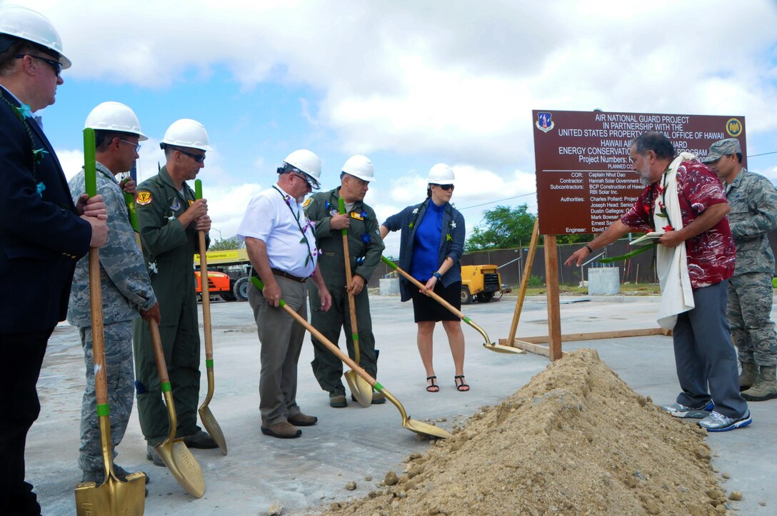 Hawaii Air National Guard officials break ground at the site of a future HIANG solar array farm on Joint Base Pearl Harbor-Hickam, Oct. 27, 2015. The solar array farm will be one piece of the HIANG's renewable energy strategy to decrease it's electricity expense and increase it's energy security. (U.S.Air National Guard photo by Senior Airman Orlando Corpuz/Released)