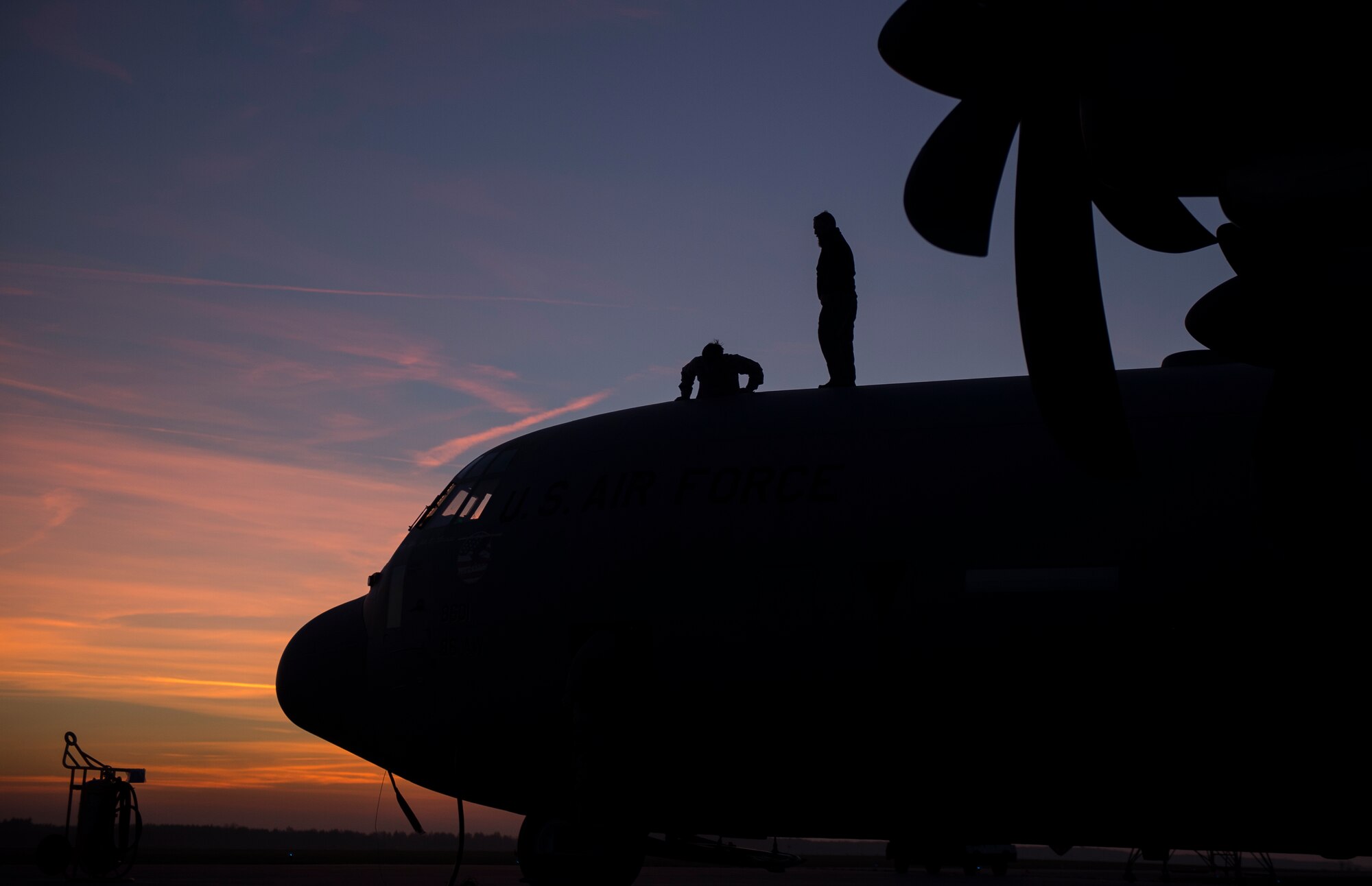 Members of the 86th Aircraft Maintenance Squadron enter a C-130J Super Hercules after performing repairs to a wing during Aviation Detachment 16-1 Oct. 27, 2015, at Powidz Air Base, Poland. Units from the 86th Airlift Wing flew to Poland to take part in the flying training deployment and support the 37th Airlift Squadron as they complete training requirements. (U.S. Air Force photo/Senior Airman Damon Kasberg)