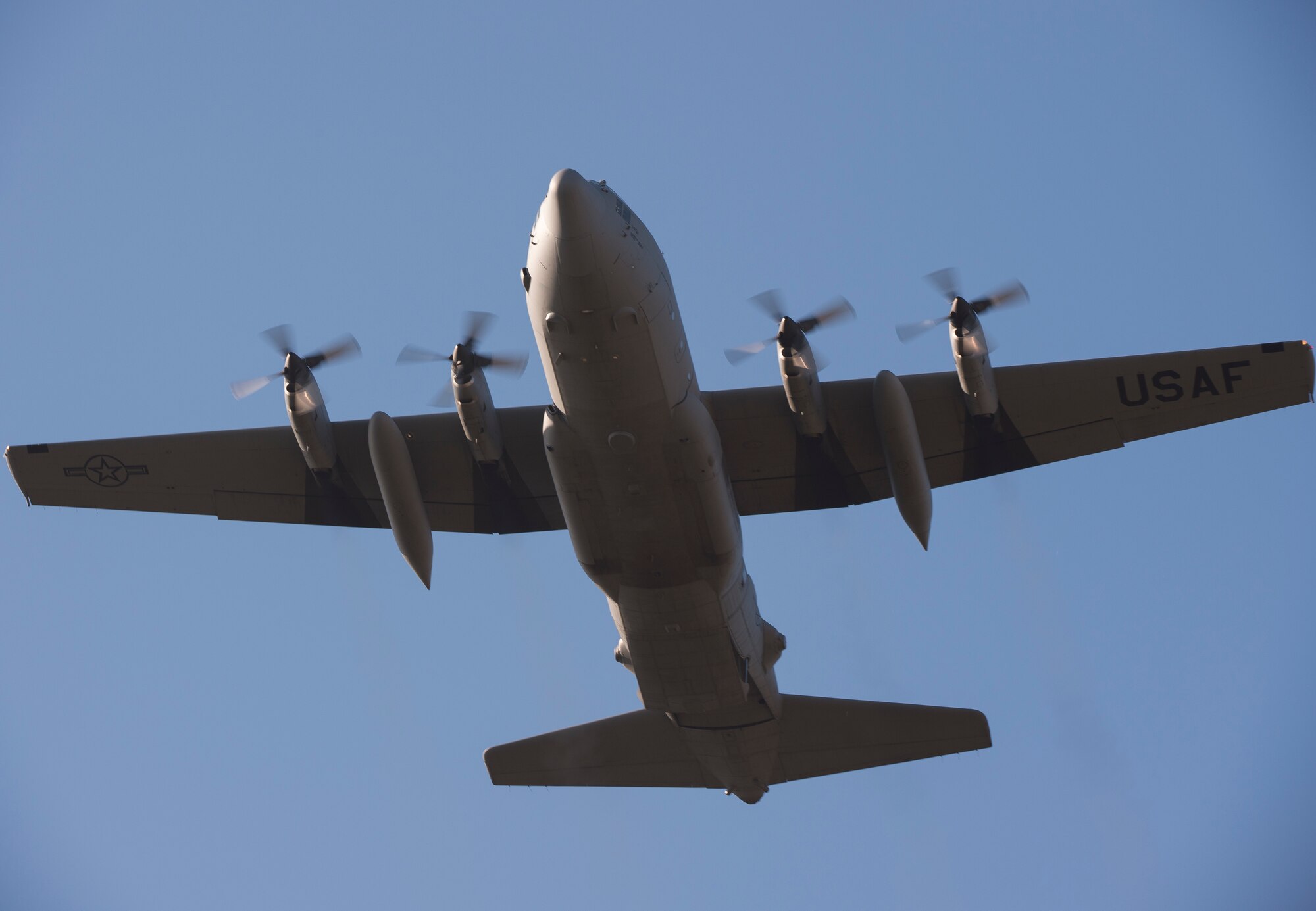 A C-130H Hercules assigned to the 169th Airlift Squadron flies to a drop zone during Aviation Detachment 16-1 Oct. 27, 2015, at Powidz Air Base, Poland. During the flying training deployment, the U.S. Air Force transferred authority of their aircraft to NATO. This authority transfer enables NATO allies to better train together. They are also able to work in the NATO construct to prepare them for future security challenges. (U.S. Air Force photo/Senior Airman Damon Kasberg)