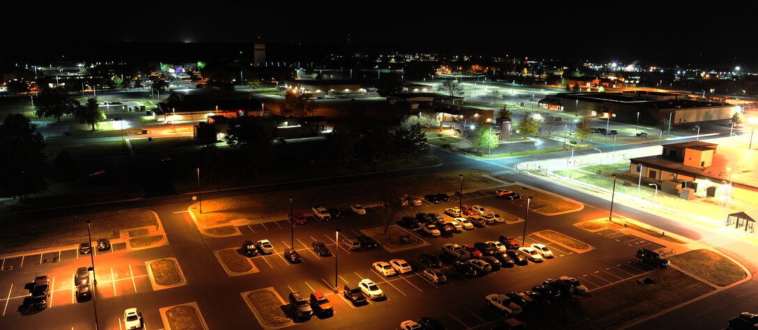 The 509th Civil Engineer Squadron engineers recently replaced fluorescent lights (bottom left) with light-emitting diode (LED) lights (top right)  at Whiteman Air Force Base, Mo., Oct. 21, 2015. LED lights eliminate light pollution, directing light towards the ground and producing accurate color rendition. The lights also have a ten year life expectancy which reduces cost and manpower. (U.S. Air Force photo by Senior Airman Joel Pfiester/Released)