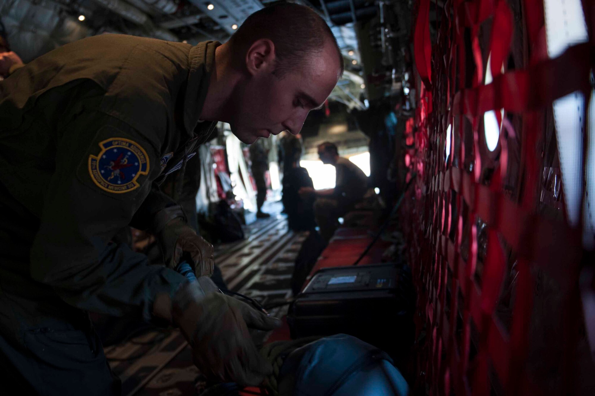 U.S. Air Force Senior Airman Zach Benjamin, 19th Aerospace Medicine Squadron High Altitude Airdrop Mission Support technician, inspects an oxygen hose prior to a high altitude flight Oct. 21, 2015, on Little Rock Air Force Base, Ark. Equipment checks are vital to mission success. (U.S. Air Force photo by Senior Airman Kaylee Clark)
