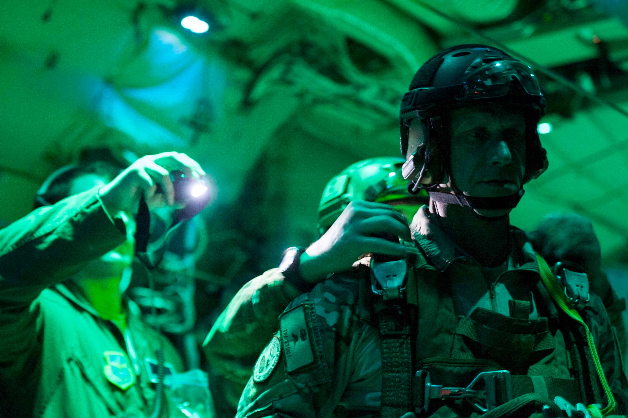 U.S. Air Force Lt. Col. Timothy Stout, 19th Aerospace Medicine Squadron High Altitude Airdrop Mission Support center director, gets inspected prior to a training jump Oct. 21, 2015, near Little Rock Air Force Base, Ark. During the training flight the students learned to assess any issues the jumpers dealt with. (U.S. Air Force photo by Senior Airman Kaylee Clark)