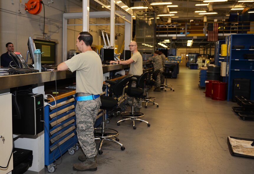 Support Airmen from the 33rd Aircrafts Maintenance Squadron assist crew chiefs with equipment before they go out to the flightline at Eglin Air Force Base, Fla., Oct. 28, 2015. The support desk is where 33rd Fighter Wing Airmen check out equipment for daily maintenance of the F-35A lightning II. (U.S. Air Force Photo/Senior Airman Andrea Posey)