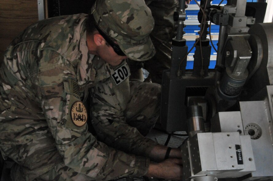 Senior Airman Joel Miller, 379th Expeditionary Civil Engineer Squadron explosive ordnance technician, prepares the F6 robot for use during an interagency training exercise Oct. 27 at Al Udeid Air Base, Qatar. Miller guided the robot inside a building to locate mock explosive devices during the exercise. (U.S. Air Force by Tech. Sgt. Terrica Y. Jones/Released)