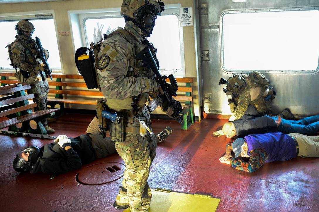Coast Guardsmen detain passengers while training in Hyannis, Mass., Oct., 22, 2015. U.S. Coast Guard photo by Petty Officer 3rd Class Ross Ruddell

