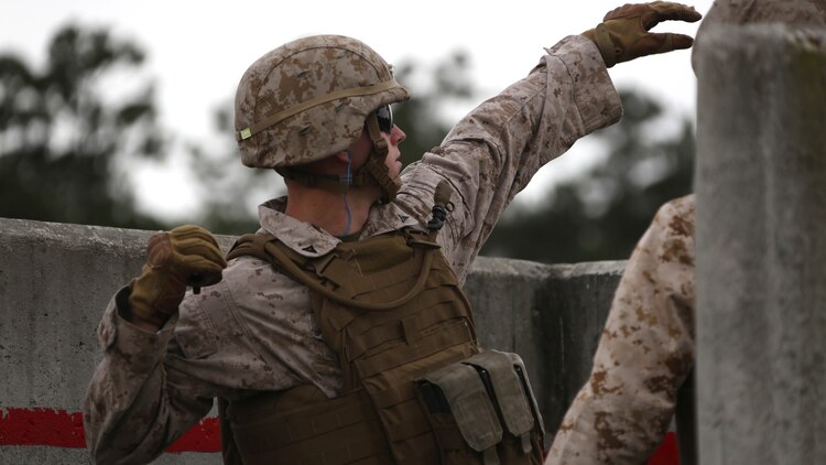 Lance Cpl. Patrick Marlowe prepares to throw an M69 Practice Grenade during a grenade and MK-19 Grenade Launcher range at Marine Corps Base Camp Lejeune, N.C., Oct. 28, 2015. More than 70 Marines with 2nd Low Altitude Air Defense Battalion took turns handling the MK19 and handheld grenades during the familiarization range. The range offered Marines the opportunity to build confidence and proficiency skills on some of the crew-served weapons they operate while providing security in a deployed environment. Marlowe is a low altitude aerial defense gunner with the battalion. 