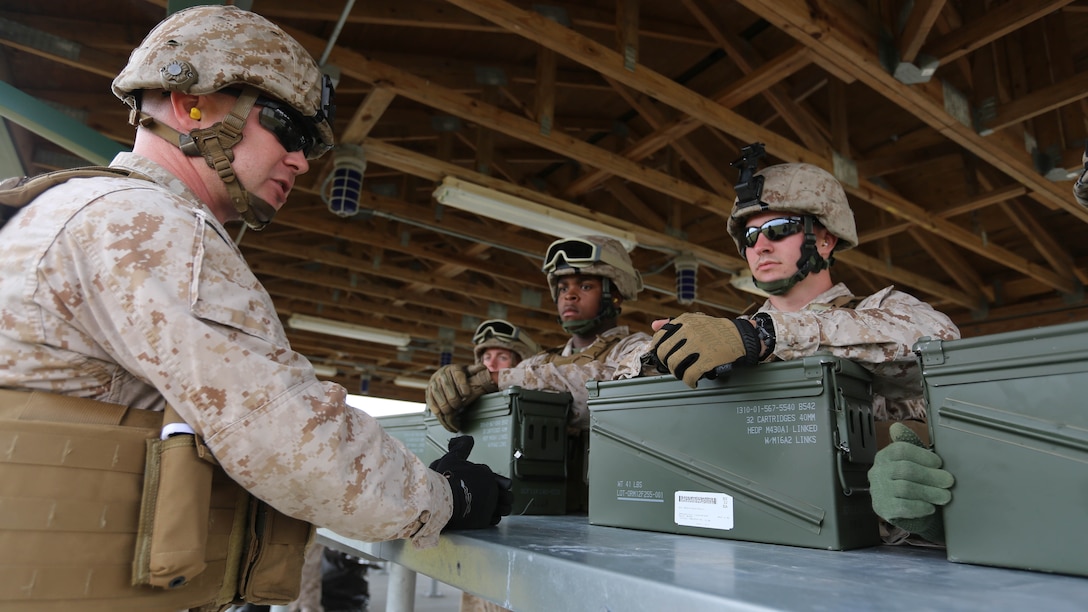 Staff Sgt. Jeremy Simms briefs a group of Marines on safety procedures during a grenade and MK19 Grenade Launcher range at Marine Corps Base Camp Lejeune, N.C., Oct. 28, 2015. More than 70 Marines with 2nd Low Altitude Air Defense Battalion took turns handling the MK-19 and handheld grenades during the familiarization range. The range offered Marines the opportunity to build confidence and proficiency skills on some of the crew-served weapons they operate while providing security in a deployed environment. Simms is a low altitude aerial defense gunner with the battalion.