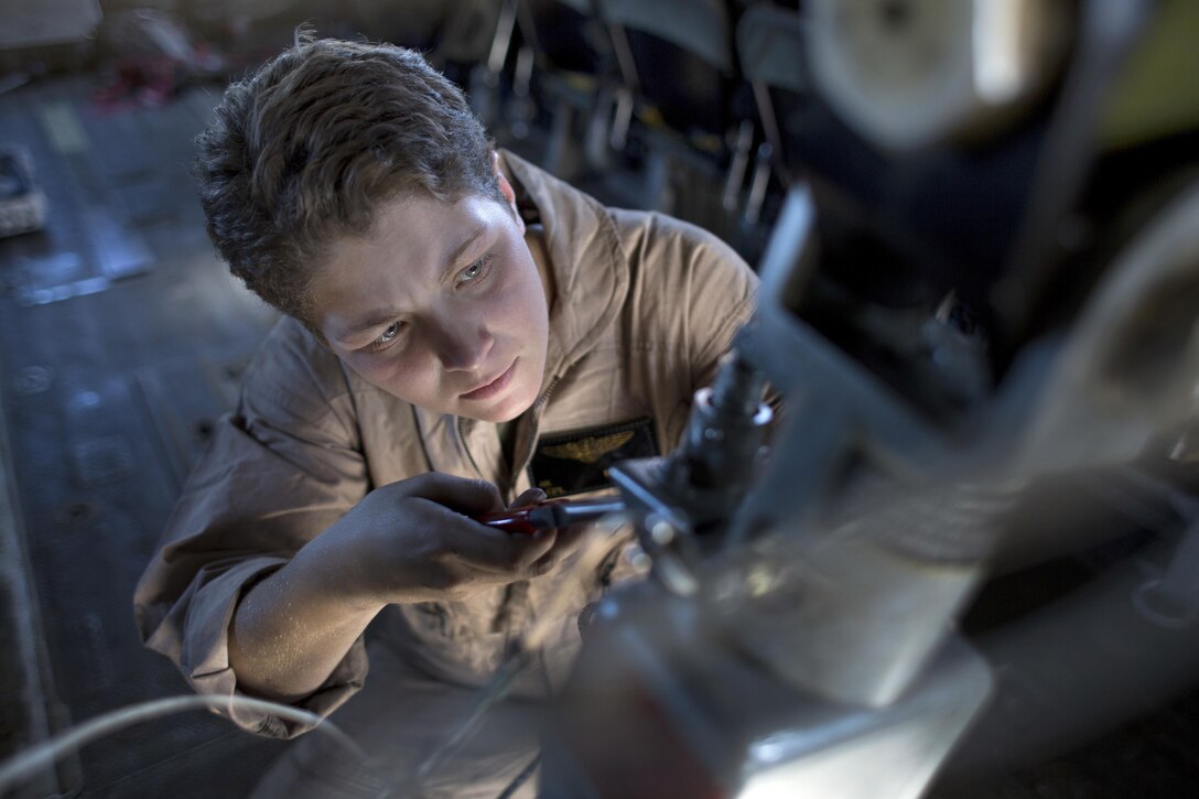 Marine Corps Lance Cpl. Alexia K. Booream conducts preflight maintenance on a CH-53E Super Stallion helicopter on Marine Corps Air Station New River, N.C., Oct. 22, 2015. Booream is a crew chief assigned to Marine Heavy Helicopter Squadron 464. U.S. Marine Corps photo by Cpl. Jodson B. Graves