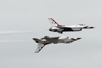 The U.S. Air Force Aerial Demonstration Squadron “Thunderbirds” practice performing F-16 acrobatic maneuvers Oct. 29, 2015 at Joint Base San Antonio-Randolph, Texas. The Thunderbirds team members arrived in preparation for the 2015 JBSA-Randolph Air Show and Open House to be held Oct. 31 and Nov. 1.  Air shows allow the Air Force to display the capabilities of our aircraft to the American taxpayer through aerial demonstrations and static displays and allowing attendees to get up close and personal to see some of the equipment and aircraft used by the U.S. military today.  (U.S. Air Force photo by Joel Martinez/Released)