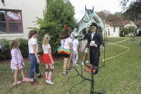Joint Base San Antonio-Randolph housing trick-or-treaters go through a haunted trail created by Ensign Cayce Stepp and his family during Halloween trick-or-treating Oct. 29, 2015 at JBSA-Randolph.  All JBSA locations hold their trick-or-treating during specific hours for the safety of the children and their families. (U.S. Air Force photo by Melissa Peterson/Released)
