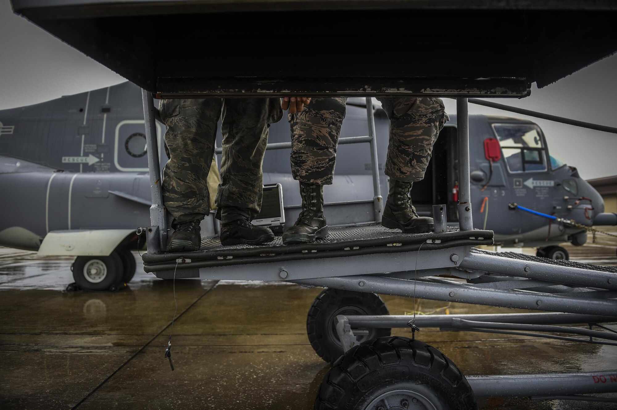 Airmen with the 801st Special Operations Aircraft Maintenance Squadron place an Infrared deflector Panel on a CV-22B Osprey at Hurlburt Field, Fla., Oct. 27, 2015. The 801st SOAMXS’s mission is to perform all equipment maintenance in support of worldwide special operations missions. (U.S. Air Force photo by Senior Airman Christopher Callaway/Released)