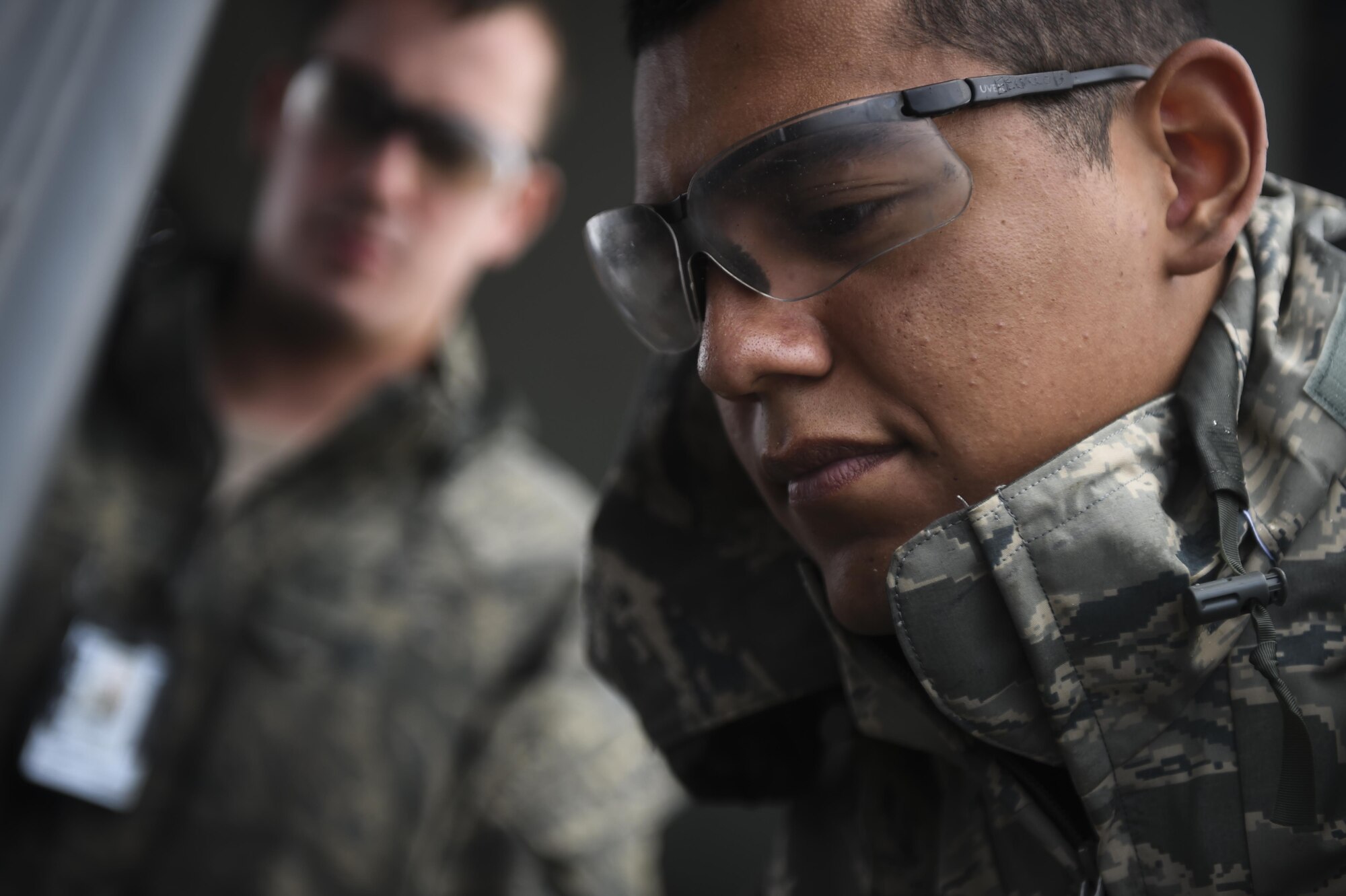 Airman 1st Class Joseph Cervantes, 801st Special Operations Aircraft Maintenance Squadron crew chief, performs routine maintenance on a CV-22B Osprey engine at Hurlburt Field, Fla., Oct. 27, 2015.  The 801st SOAMXS’s mission is to perform all equipment maintenance in support of worldwide special operations missions. (U.S. Air Force photo by Senior Airman Christopher Callaway/Released)