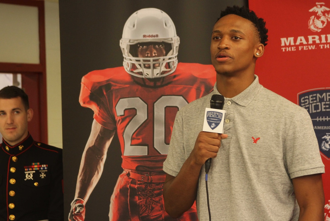 Diondre Overton, a wide receiver for the Page High School football team, speaks during his Semper Fidelis All-American Bowl jersey presentation at Page High School in Greensboro, North Carolina, Oct. 22, 2015. Overton was selected to play in the bowl for his skill as a wide receiver, his academics and his leadership ability.  The Semper Fidelis All-American Bowl allows the Marine Corps to purposefully engage with well-rounded student athletes and share leadership lessons that will enable future success. It will be played on Jan. 3, 2016, in Carson, California, and will be broadcast on Fox Sports 1. (U.S. Marine Corps photo by Sgt. Dwight A. Henderson/Released) 