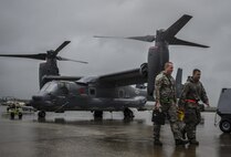 Senior Airman Daniel Gurka, left, and Staff Sgt. John Tomassi, 801st Special Operations Aircraft Maintenance Squadron crew chiefs, complete routine maintenance on a CV-22B Osprey at Hurlburt Field, Fla., Oct. 27, 2015. The 801st SOAMXS’s mission is to perform all equipment maintenance in support of worldwide special operations missions. (U.S. Air Force photo by Senior Airman Christopher Callaway/Released) 