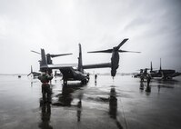 A CV-22B Osprey is towed into Freedom Hangar at Hurlburt Field, Fla., Oct. 27, 2015. Despite the after-effects of Hurricane Patricia, crew chiefs with the 801st SOAXMS continued performing maintenance to accomplish the mission. (U.S. Air Force photo by Senior Airman Christopher Callaway/Released)