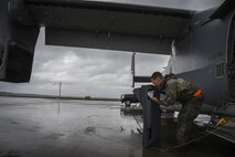 Senior Airman Braden Ferrell, 801st Special Operations Aircraft Maintenance Squadron crew chief, prepares to reattach an infrared deflector panel on a CV-22B Osprey during routine maintenance at Hurlburt Field, Fla., Oct. 27, 2015. The Osprey is a tiltrotor aircraft that combines the vertical takeoff, hover and vertical landing qualities of a helicopter with the long-range, fuel efficiency and speed characteristics of a turboprop aircraft. (U.S. Air Force photo by Senior Airman Christopher Callaway/Released) 
