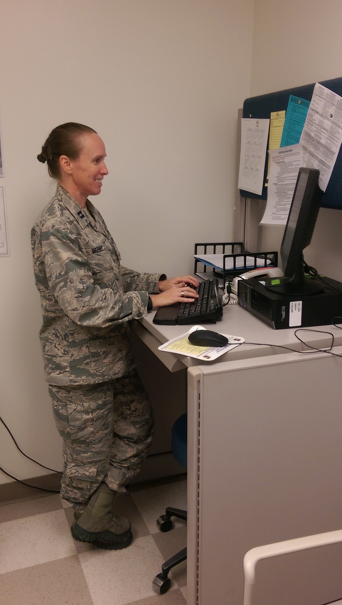 Capt. Jennifer Varney, a family nurse practitioner and family health flight commander, checks MiCARE for patient requests at the Family Health Clinic at Maxwell Air Force Base, Ala. (Courtesy photo)