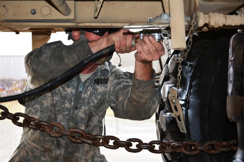 Spc. Adam Johnson, a wheeled vehicle mechanic assigned to Forward Support Company 62nd Engineer Battalion, connects the air hose from a tow vehicle to a simulated disabled vehicle during the Wheeled Vehicle Recovery Course at Regional Training Site Maintenance-Fort Hood, Texas, Oct. 22, 2015.