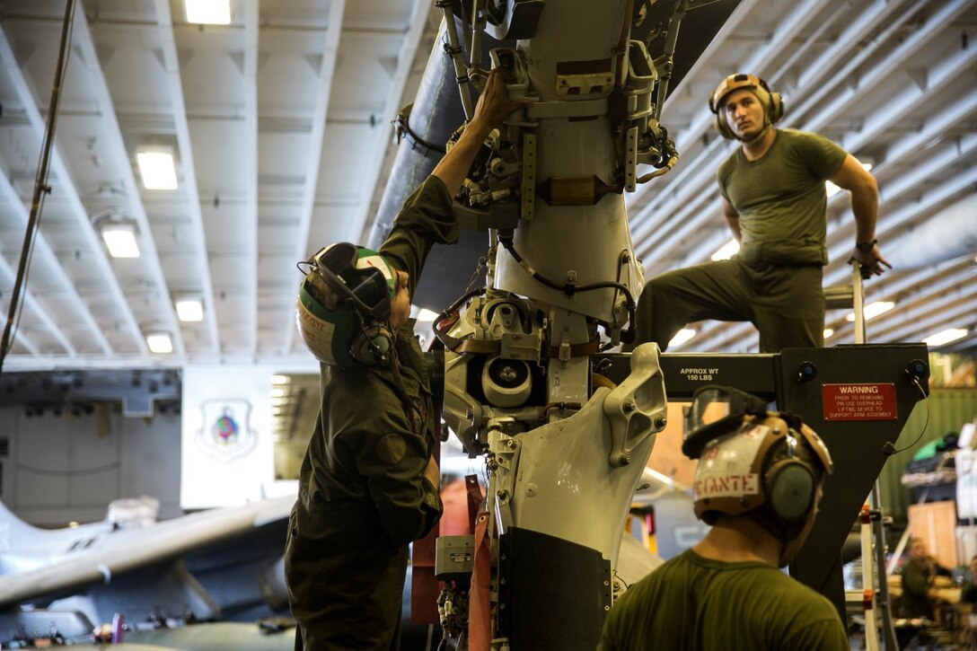 GULF OF OMAN (Oct. 26, 2015) U.S. Marines with Medium Marine Tiltrotor Squadron 161 (Reinforced), 15th Marine Expeditionary Unit, perform daily maintenance on the blades of an MV-22B Osprey aboard the amphibious assault ship USS Essex (LHD 2). Marines maintain their aircraft daily to ensure they function properly at a moment’s notice. The 15th MEU, embarked on the ships of the Essex Amphibious Ready Group, is deployed to maintain regional security in the U.S. 5th Fleet area of operations.  (U.S. Marine Corps photo by Sgt. Anna Albrecht/ Released)