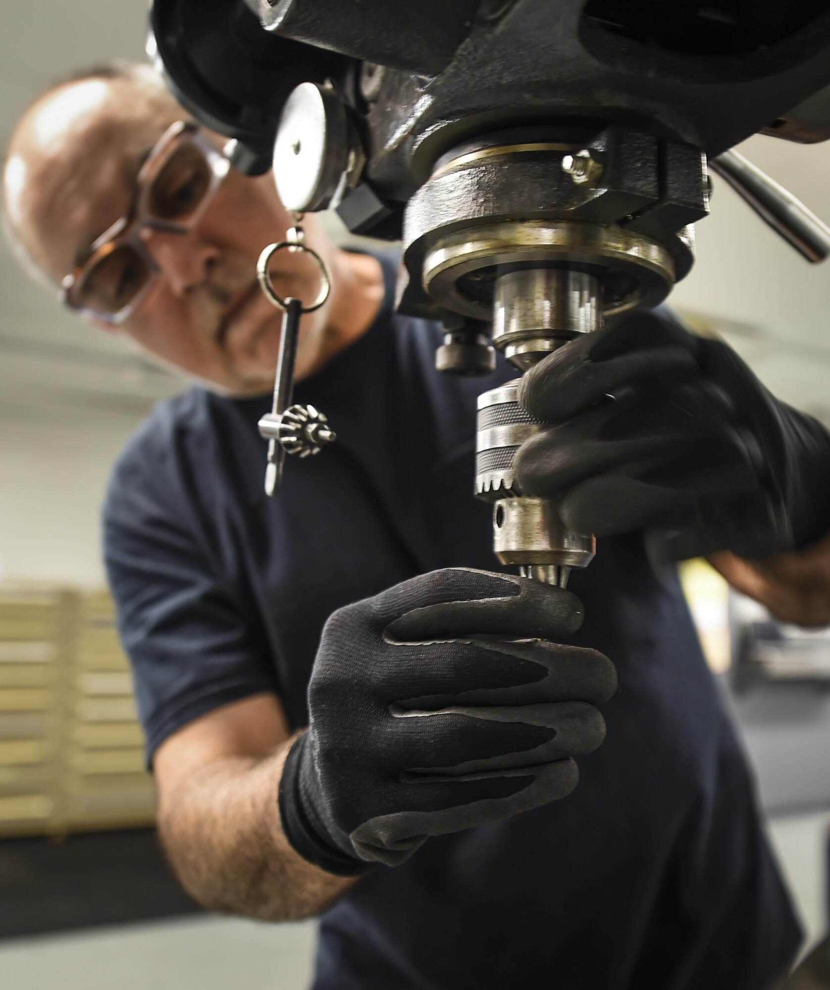 Ali Hooshmand, 1st Special Operations Maintenance Squadron, uses a drill press to complete a work order on Hurlburt Field, Fla., Oct. 22, 2015. The members that work in sheet metal use advanced equipment and techniques to reverse engineer and manufacture aircraft parts. (U.S. Air Force photo by Senior Airman Christopher Callaway/Released) 