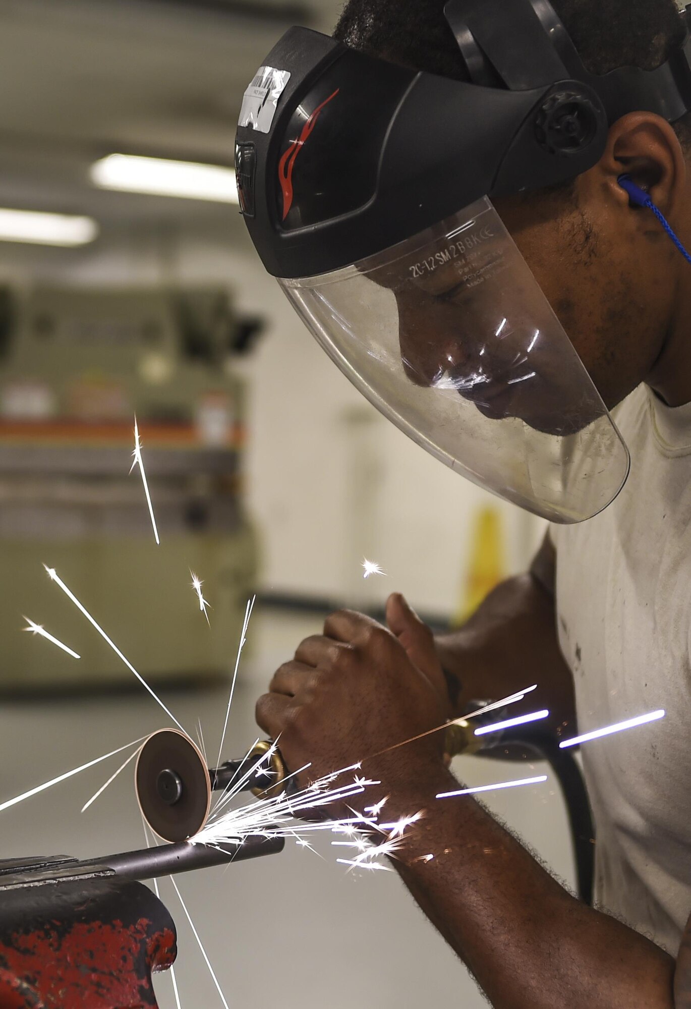 Staff Sgt. Sean Ciccel, 1st Special Operations Maintenance Squadron aircraft structural maintenance craftsman, uses a cutting wheel to cut aircraft tubing at Hurlburt Field, Fla., Oct. 22, 2015. The 1st SOMXS aircraft structural maintenance Airmen construct aircraft parts for the CV-22B Osprey, AC-130U Spooky, MC-130H Combat Talon II and the AC-130J Ghostrider. (U.S. Air Force photo by Senior Airman Christopher Callaway/Released) 