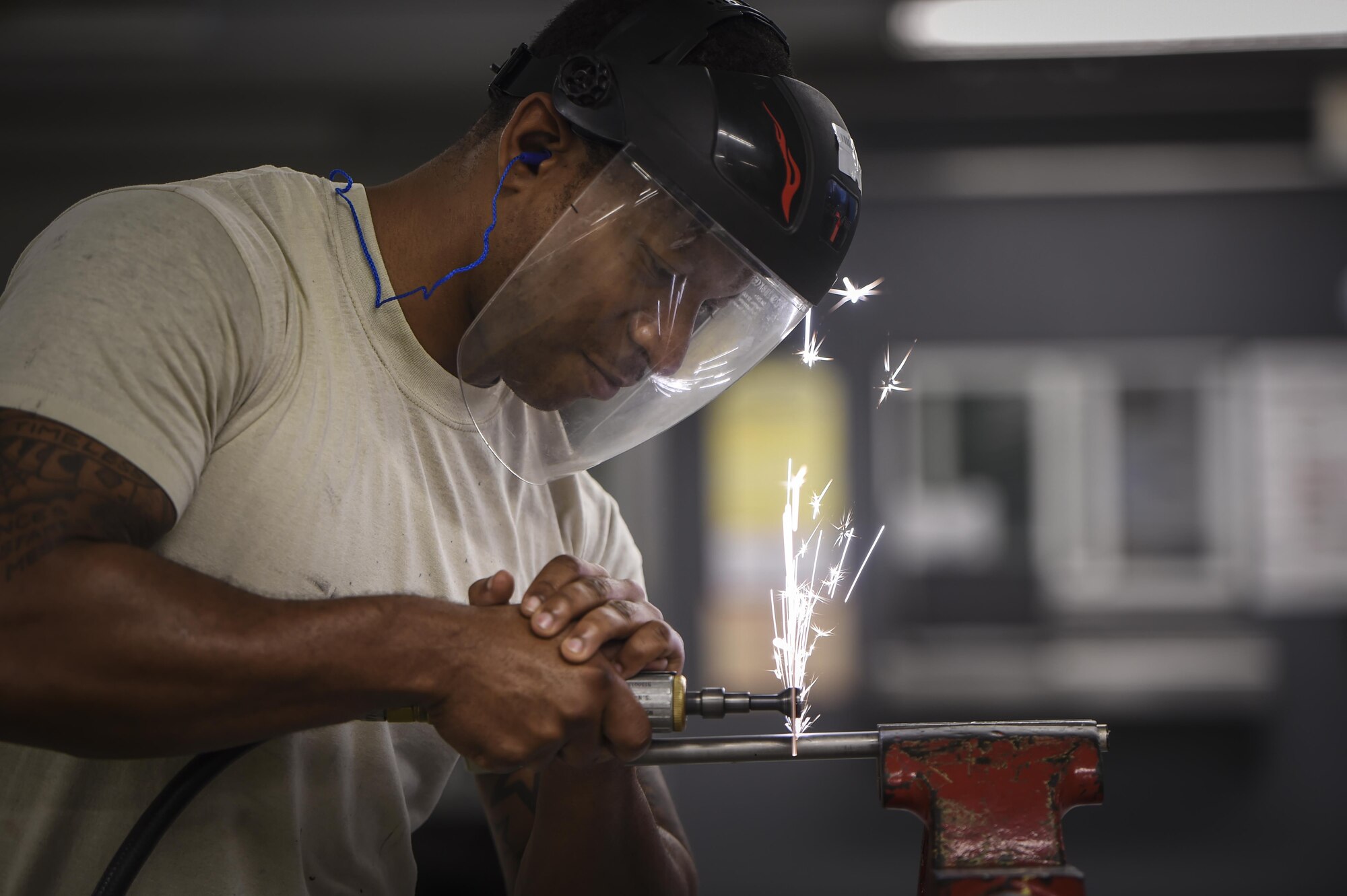 Staff Sgt. Sean Ciccel, 1st Special Operations Maintenance Squadron aircraft structural maintenance craftsman, uses a cutting wheel to resize aircraft tubing at Hurlburt Field, Fla., Oct. 22, 2015. The 1st SOMXS aircraft structural maintenance Airmen construct aircraft parts for the CV-22B Osprey, AC-130U Spooky, MC-130H Combat Talon II and the AC-130J Ghostrider. (U.S. Air Force photo by Senior Airman Christopher Callaway/Released) 