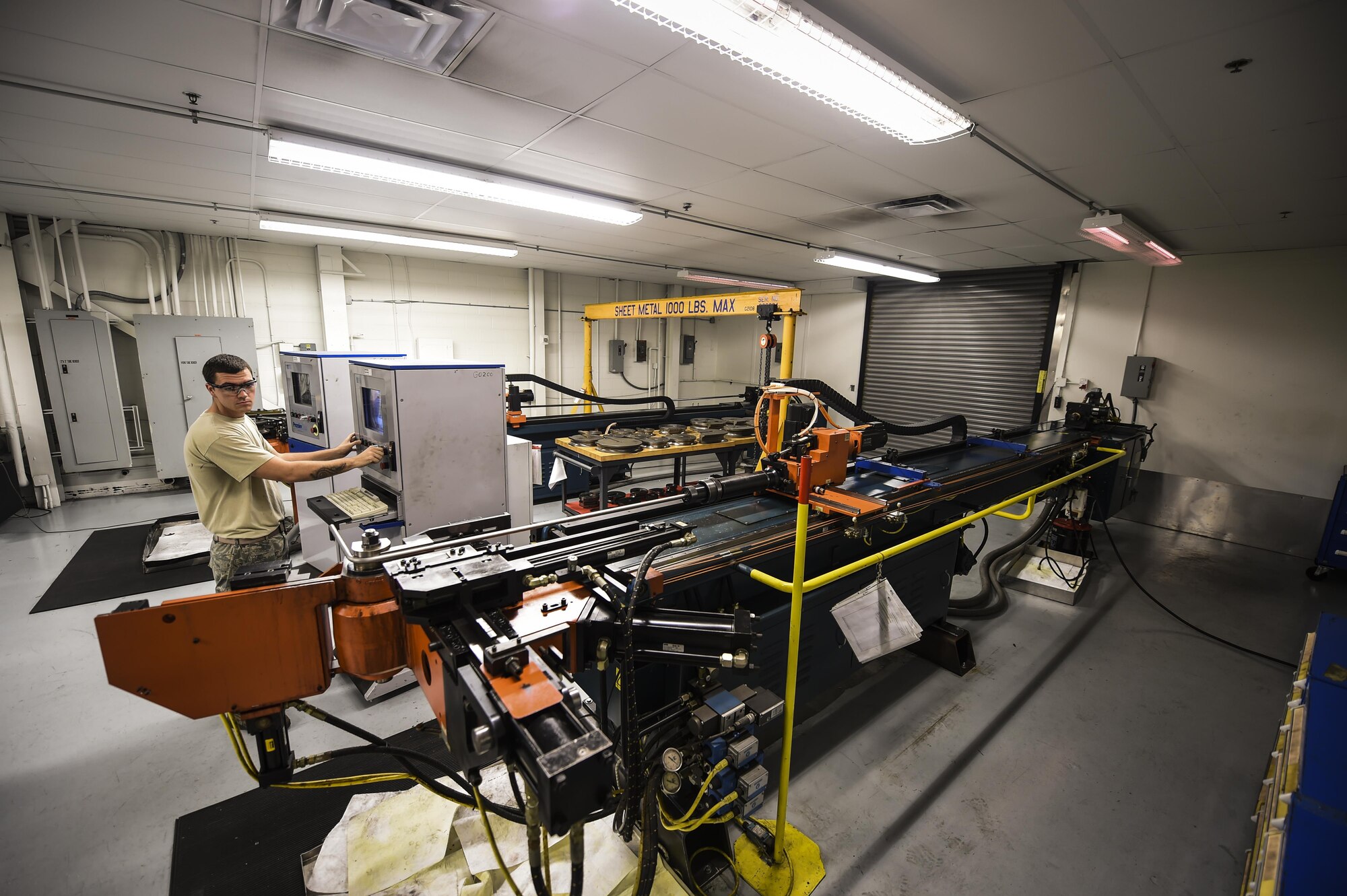 Senior Airman Dalton Obenshain, 1st Special Operations Maintenance Squadron aircraft structural maintenance journeyman, fabricates aircraft tubing by reshaping it, on Hurlburt Field, Fla., Oct. 22, 2015. Airmen with the 1st SOMXS aircraft structural maintenance shop the Air Force more than $100,000 a year, replacing damaged parts with items fabricated in their shop. (U.S. Air Force photo by Senior Airman Christopher Callaway/Released) 