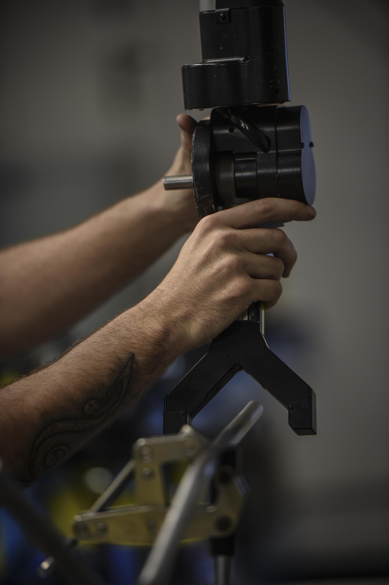 Senior Airman Dalton Obenshain, 1st Special Operations Maintenance Squadron aircraft structural maintenance journeyman, uses a laser arm to mimic the curve of aircraft tubing on new tubes, at Hurlburt Field, Fla., Oct. 22, 2015. Airmen with the 1st SOMXS aircraft structural maintenance save the Air Force more than $100,000 a year, replacing damaged parts with items fabricated in their shop. (U.S. Air Force photo by Senior Airman Christopher Callaway/Released)