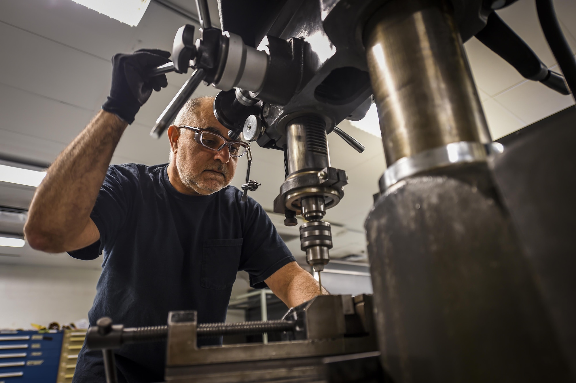 Ali Hooshmand, 1st Special Operations Maintenance Squadron, uses a drill press to complete a work order on Hurlburt Field, Fla., Oct. 22, 2015. The members that work in sheet metal use advanced equipment and techniques to reverse engineer and manufacture aircraft parts. (U.S. Air Force photo by Senior Airman Christopher Callaway/Released) 