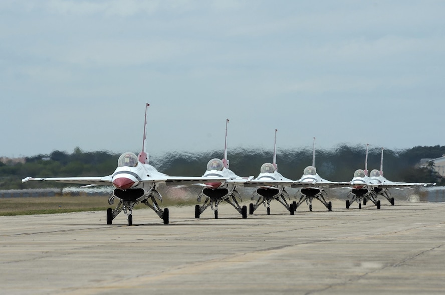 The U.S. Air Force Aerial Demonstration Squadron “Thunderbirds” practice performing F-16 acrobatic maneuvers Oct. 29, 2015 at Joint Base San Antonio-Randolph, Texas. The Thunderbirds team members arrived in preparation for the 2015 JBSA-Randolph Air Show and Open House to be held Oct. 31 and Nov. 1.  Air shows allow the Air Force to display the capabilities of our aircraft to the American taxpayer through aerial demonstrations and static displays and allowing attendees to get up close and personal to see some of the equipment and aircraft used by the U.S. military today.  (U.S. Air Force photo by Joel Martinez)