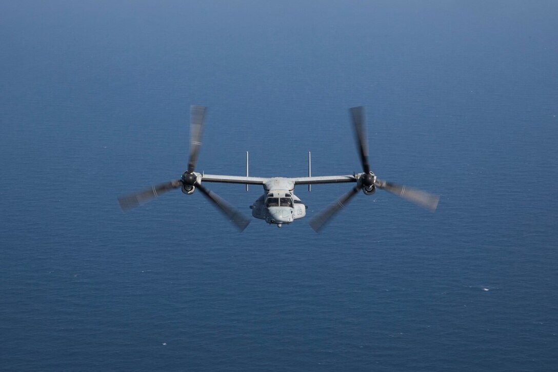 GULF OF OMAN (Oct. 29, 2015) An MV-22 Osprey with Medium Marine Tiltrotor Squadron 161 (Reinforced), 15th Marine Expeditionary Unit, departs the amphibious assault ship USS Essex (LHD 2). The Marines practiced shooting an M240 medium machine gun from the Osprey to familiarize themselves with the weapon and enhance their marksmanship. The 15th MEU, embarked on the ships of the Essex Amphibious Ready Group, is deployed to maintain regional security in the U.S. 5th Fleet area of operations. (U.S. Marine Corps photo by Sgt. Anna Albrecht/Released)